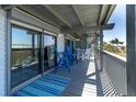 Spacious balcony seating area with views of the ocean and beachside at 200 120Th W Ave # 3A, Treasure Island, FL 33706