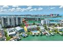 Desirable exterior view of property with waterfront access, dock, and community pool at 234 Dolphin Pt # 1, Clearwater Beach, FL 33767