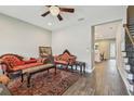 Elegant living room boasts hardwood floors, a ceiling fan, and an open floorplan at 4007 W Gray St, Tampa, FL 33609