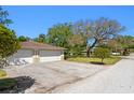 Attached two car garage with additional parking in a quiet neighborhood at 4302 W Woodmere Rd, Tampa, FL 33609