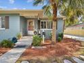 Close up view of the inviting front porch, exterior with well manicured landscaping at 1225 26Th N St, St Petersburg, FL 33713