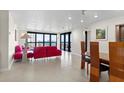 Bright living room featuring a balcony and views of the water at 2413 Bayshore Blvd # 605, Tampa, FL 33629