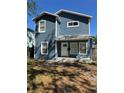Charming two-story home with a covered front porch and freshly painted blue exterior at 2527 13Th S Ave, St Petersburg, FL 33701