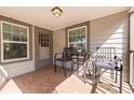 Inviting covered front porch with seating area to enjoy outdoor living at 505 27Th N Ave, St Petersburg, FL 33704