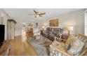 Cozy living room featuring wood floors, tropical decor, and lots of natural light at 5080 Locust Ne St # 321, St Petersburg, FL 33703