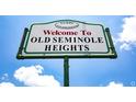 Neighborhood sign welcomes you to Old Seminole Heights under a sunny, cloud-flecked sky at 7006 N Duncan Ave, Tampa, FL 33604