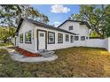Lovely renovated two-story home with modern exterior paint, trim and landscaping at 7210 8Th N Ave, St Petersburg, FL 33710