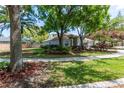 Well-maintained lawn and attractive landscaping enhance the curb appeal of this inviting home at 11704 Derbyshire Dr, Tampa, FL 33626