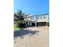 Beautiful two-story home boasting a spacious driveway, lush landscaping, and an attached two-car garage at 11936 Sand Myrtle Rd, Riverview, FL 33579
