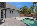 Backyard pool featuring a deck and privacy fence at 1330 Cherry Ne St, St Petersburg, FL 33701