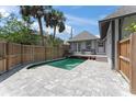 Beautiful backyard with a pool, patio, and new fence, perfect for entertaining at 1330 Cherry Ne St, St Petersburg, FL 33701