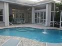 Inviting backyard pool area, perfect for outdoor entertaining and relaxation, with a covered patio at 1803 Longview Ln, Tarpon Springs, FL 34689