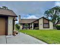 Charming home with a manicured lawn and attractive curb appeal at 2250 Sequoia Dr, Clearwater, FL 33763