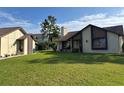 Charming home with a manicured lawn and exterior with attractive architectural features at 2250 Sequoia Dr, Clearwater, FL 33763