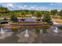 Beautiful community sign with a water feature and landscaping at Stonebrier Lutz at 2935 Winglewood Cir, Lutz, FL 33558