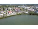 An aerial view shows the building next to a body of water and a mangrove at 7037 Sunset S Dr # 205, South Pasadena, FL 33707