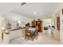 Open-concept dining area with tile floors, and easy access to the living room and kitchen at 90 S Highland Ave # 6, Tarpon Springs, FL 34689