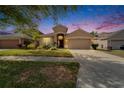 Beautiful single-story home featuring a two-car garage and well-kept lawn at 10229 Avelar Ridge Dr, Riverview, FL 33578