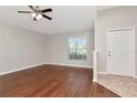 Bright living room featuring beautiful hardwood floors and neutral wall paint at 12310 Streambed Dr, Riverview, FL 33579