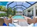 The expansive screened-in pool area is ideal for both lounging and entertaining guests at 13008 Eagles Entry Dr, Odessa, FL 33556