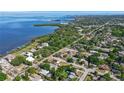 Beautiful aerial view showcasing the neighborhood's proximity to the bay with stunning water views at 1424 Castleworks Ln, Tarpon Springs, FL 34689
