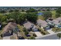 Features a beautiful lake view and well-manicured lawns in a lovely neighborhood at 322 Northway Dr, Sun City Center, FL 33573