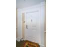 Apartment door with stylish decor, columns, and a welcome mat at 4516 Seagull Dr # 615, New Port Richey, FL 34652