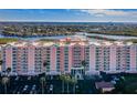 Beautiful waterfront condo building with large parking lot and tropical landscaping at 4516 Seagull Dr # 615, New Port Richey, FL 34652