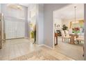 Bright foyer leads to the dining room, showcasing tile floors and soaring ceilings at 9008 Quail Creek Dr, Tampa, FL 33647