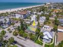 Aerial view of a lovely single-Gathering home, lush yard, and proximity to the beach at 107 13Th Ave, St Pete Beach, FL 33706
