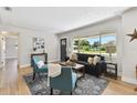 Inviting living room with a large window, comfortable seating, and a stylish rug, perfect for relaxation and entertaining at 1165 63Rd S Ave, St Petersburg, FL 33705