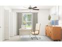 Well-lit home office features a functional desk, comfortable chair, and modern decor for a productive workspace at 12620 Aura Moonlight Ter, Parrish, FL 34219