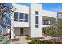 Modern home showcasing a paved walkway leading to the front entrance, complemented by minimalist landscaping at 2003 Gulf Way, St Pete Beach, FL 33706