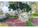 West Shore Village entrance sign surrounded by landscaping and colorful flowers at 3203 40Th S Way # B, St Petersburg, FL 33711