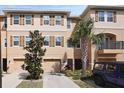Exterior view of a two-story townhome with well-maintained landscaping at 5524 Yellowfin Ct, New Port Richey, FL 34652