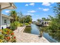 Scenic backyard featuring a private dock and waterfront access at 636 Tarawitt Dr, Longboat Key, FL 34228