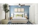 Serene bedroom showcasing a plush bed, stylish wall art, blue accent wall, and a calming atmosphere at 8532 Bella Mar Trl, Parrish, FL 34219