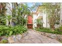 Beautiful condo exterior featuring lush landscaping and a welcoming entrance at 1012 Pearce Dr # 304, Clearwater, FL 33764