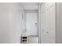 Bright foyer with shoe storage, white closets, and a clean, modern design at 1012 Pearce Dr # 304, Clearwater, FL 33764