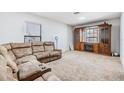 Comfortable living room featuring plush seating and a built-in entertainment center at 11922 Winterset Cove Dr, Riverview, FL 33579
