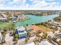 Aerial view showcasing the turquoise canal-front homes in a scenic coastal community at 12312 Lagoon Ln, Treasure Island, FL 33706
