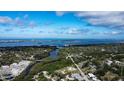 Breathtaking aerial view of a waterfront community with lush greenery, islands, and beautiful ocean at 1345 Springdale St, Clearwater, FL 33755