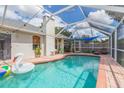 Inviting screened-in pool area with a spacious deck and a relaxing atmosphere at 1419 Trail Boss Ln, Brandon, FL 33511