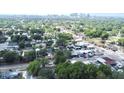 Scenic aerial view of a neighborhood with lush greenery and a distant city skyline at 1515 E 31St Ave, Tampa, FL 33610