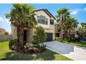 Charming two-story home featuring a well-manicured front yard with mature trees and a concrete driveway at 1626 Tallulah Ter, Wesley Chapel, FL 33543
