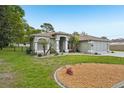 Attractive home with a well-maintained lawn, landscaping, and a driveway, perfect for suburban living at 2016 Alameda Dr, Spring Hill, FL 34609