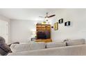 Inviting living room with entertainment center and comfortable seating at 2042 Australia W Way # 12, Clearwater, FL 33763