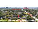 Aerial view showing the home's location on a tree-lined street near major roadways and landmarks at 3614 S Lois Ave, Tampa, FL 33629