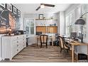 Bright office with multiple desks, modern decor, wood floors, and natural light from plantation shutters at 4015 10Th N Ave, St Petersburg, FL 33713