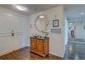 Charming condo hallway with wooden floors and decorative wall art at 6 Belleview Blvd # 505, Belleair, FL 33756